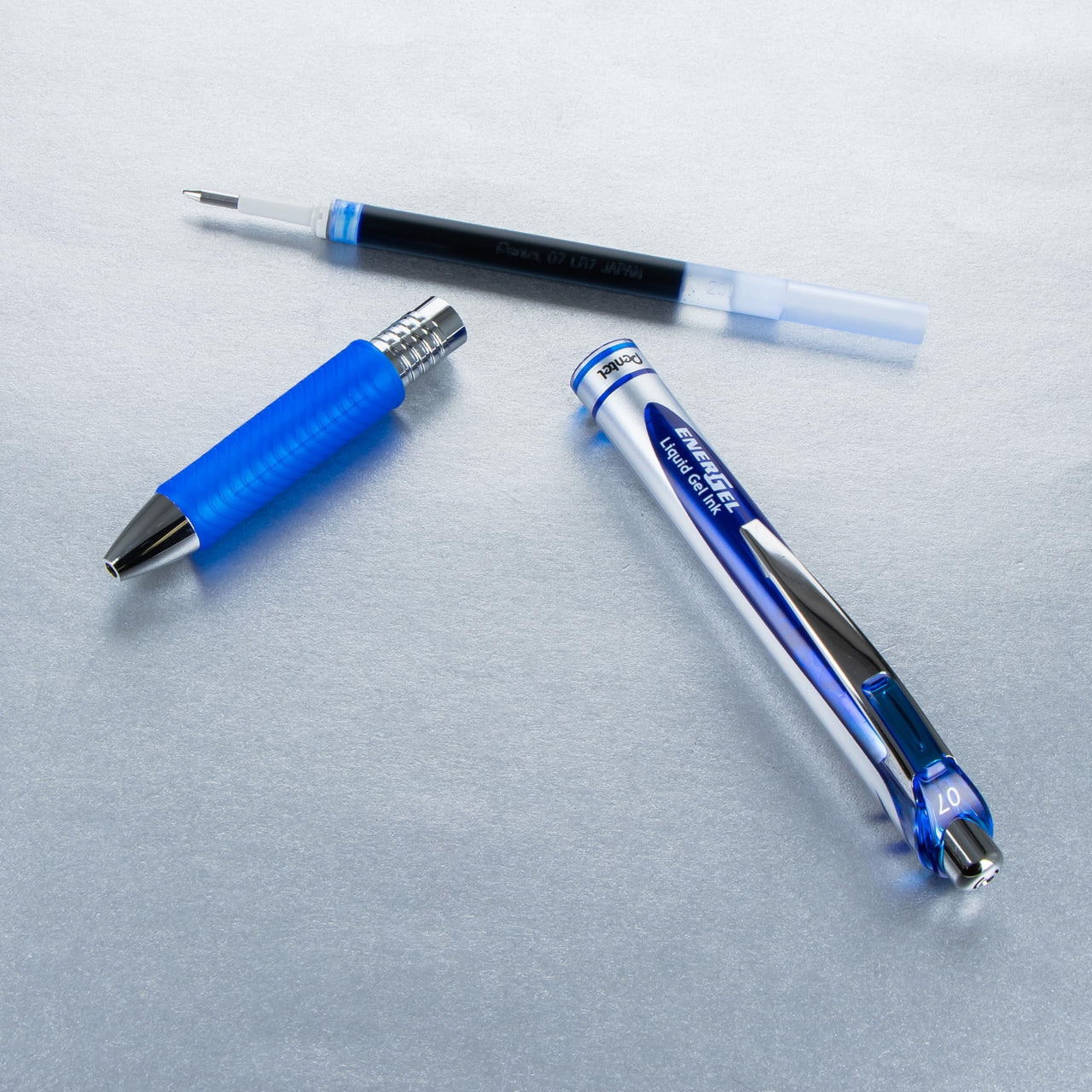 Pentel® EnerGel™ RTX Retractable Liquid Gel Pens, Medium Point, 0.7 mm, 54% Recycled, Blue Barrel, Blue Ink, Pack Of 12 Pens